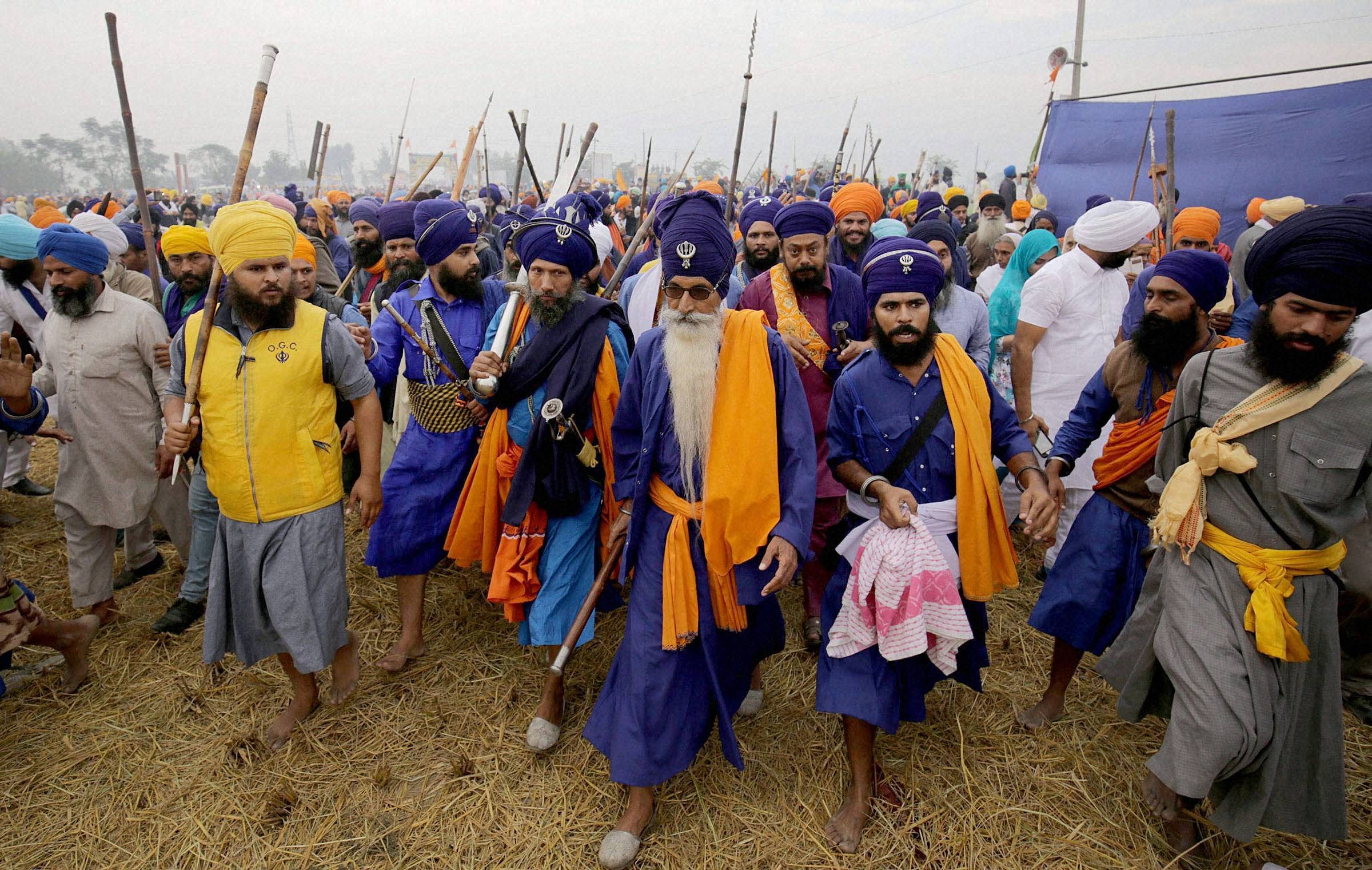 Nihangs arrive to participate in the Sarbat Khalsa with their traditional weapons at Chaba village near Amritsar.