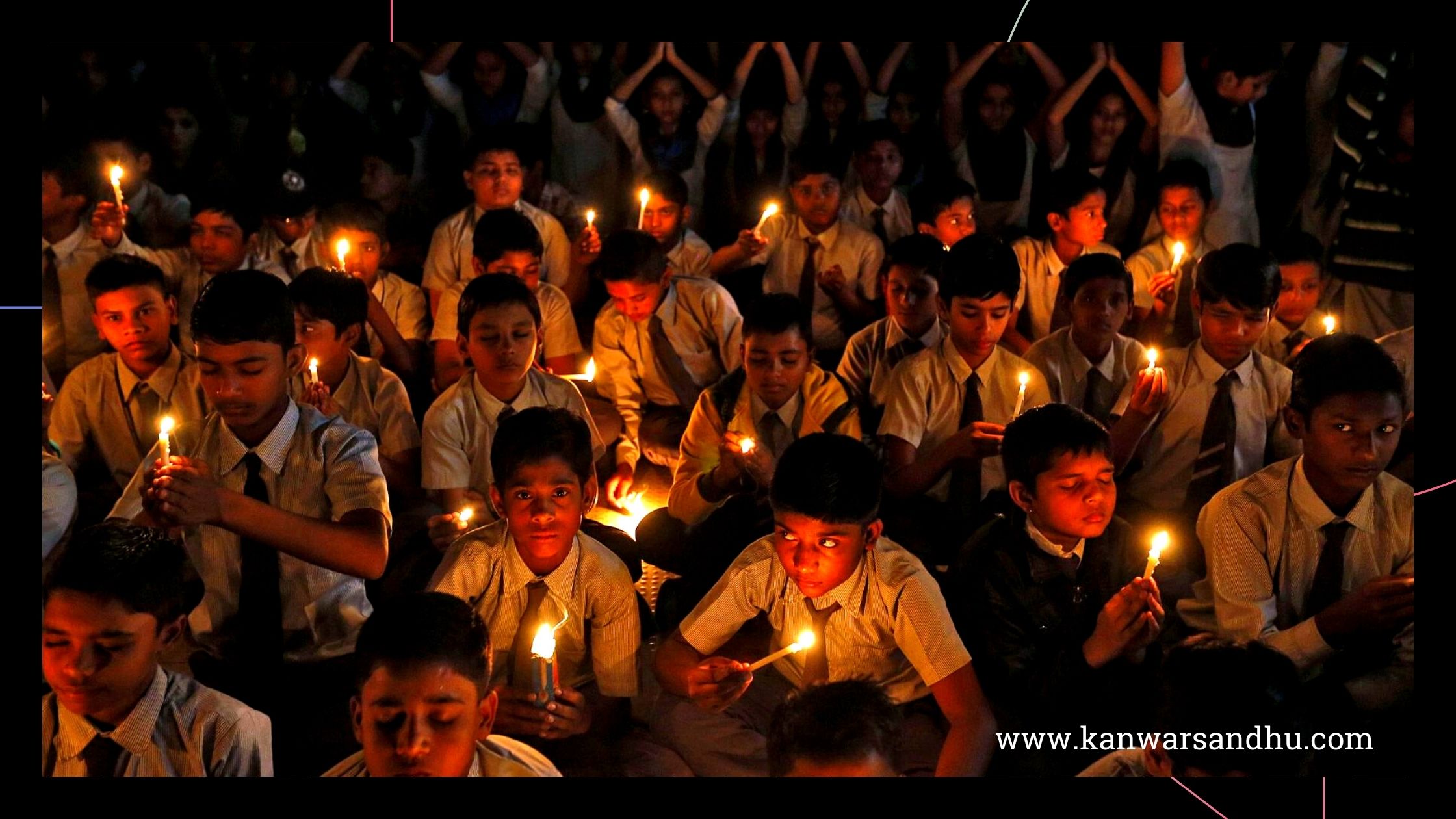 Students hold candles as they take part in a special prayer ceremony for the victims of the terror attack at Pathankot air base, at a school in Ahmedabad, January 5, 2016.